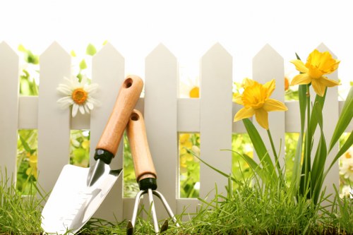 Professional gardener trimming hedges for enhanced curb appeal
